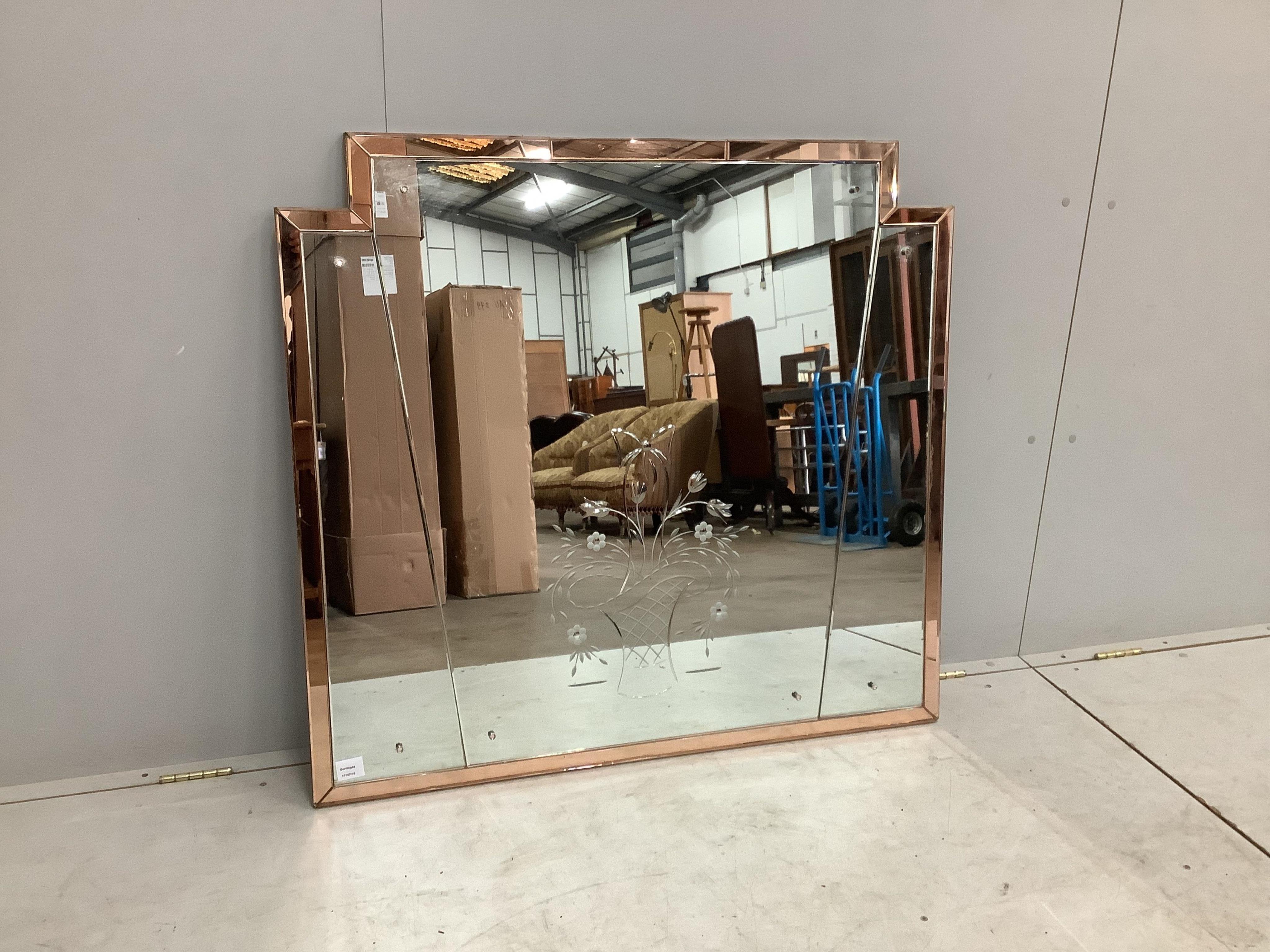 An Art Deco style engraved, peach and clear glass overmantel mirror, width 108cm, height 101cm. Condition - fair